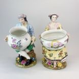 A pair of continental porcelain figurines of a couple holding porcelain bowls, H. 30cm.