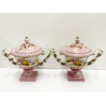 A pair of continental porcelain urns and covers, H. 20cm.