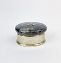 A gilt lined white metal (tested silver) pill box with polished labradorite lid, W. 4cm.