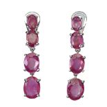 A pair of 925 silver drop earrings set with oval cut rubies, L. 3.3cm.