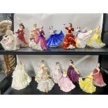 A group of sixteen Royal Doulton, Coalport and other figurines.