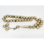 Islamic interest: A very large strand of silver prayer beads containing the 99 names of god, bead