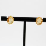 A pair of 9ct yellow gold mounted cameo stud earrings, L. 1cm.