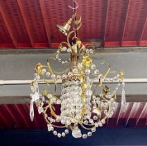 A pair of chandelier light fittings, longest drop H. 30cm, with a further single chandelier.