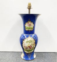 An early 20th century soft paste porcelain vase mantled as a lamp base, H. 56cm.