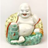 A large mid-20th century Chinese porcelain figure of Putai, H. 26. W. 28cm.