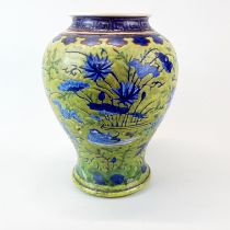 A rare 18th century Chinese hand painted soft paste porcelain vase with underglaze blue and white