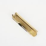 An unusual Cartier 9ct gold pen knife and propelling pencil.