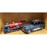 Two handmade tin plate models of a steam engine and a London taxi, L. 31cm.