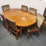 An extending G Plan fresco teak dining table together with a set of six matching G Plan chairs,