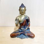 A Tibetan bronze figure of a seated Buddha, H. 20cm.