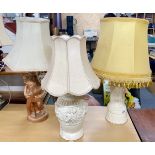 Three vintage plaster table lamps and shades, tallest H. 70cm.