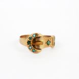 A 9ct rose gold buckle ring set with turquoise, (N). Three replacement stones.
