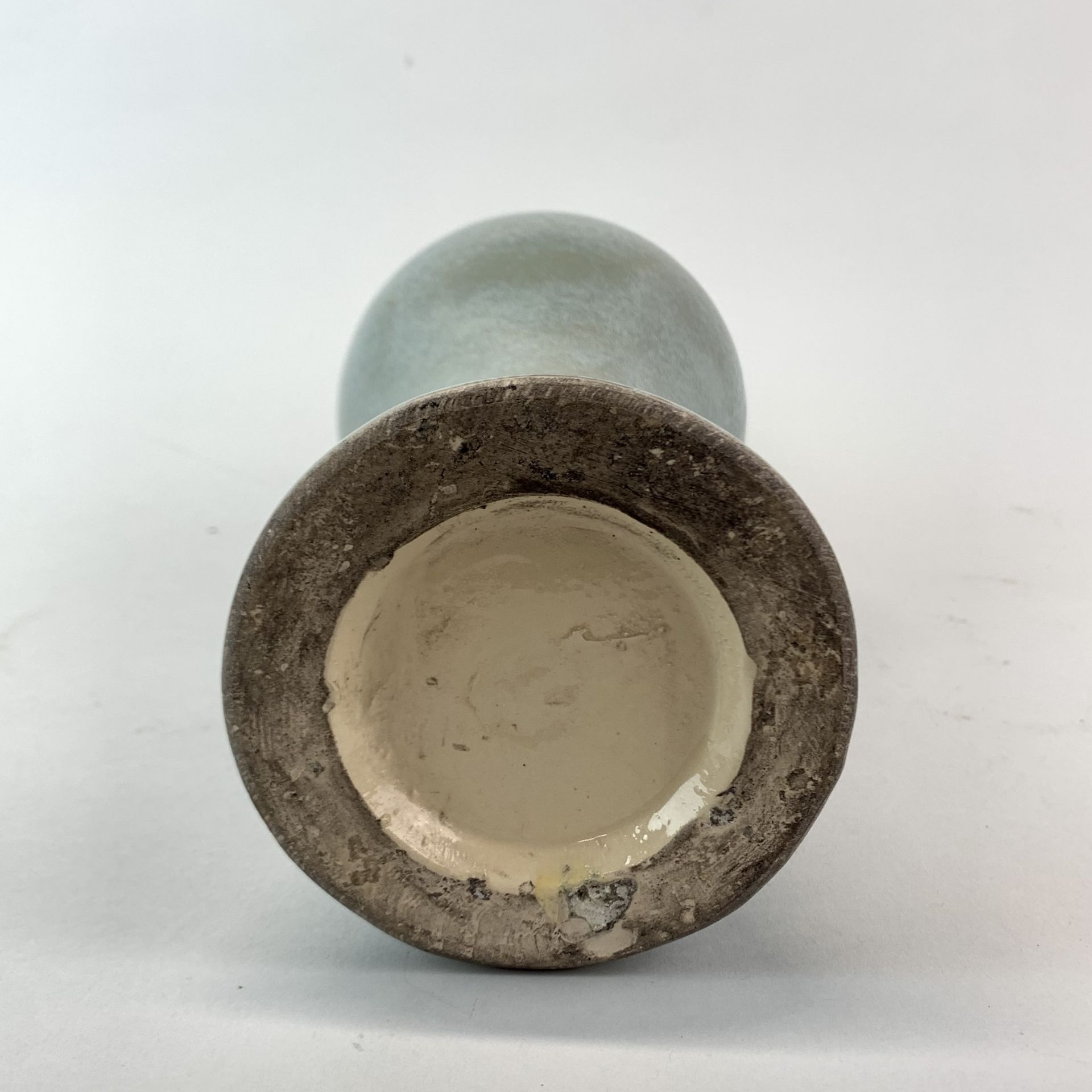 A celadon glazed heavily potted soft paste porcelain vase, probably Korean. H. 32cm. - Image 2 of 2