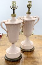 A pair of early 20th century pink opaline glass table lamp bases, H. 50cm.
