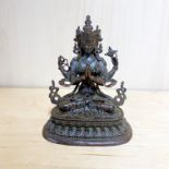 A small finely detailed Tibetan bronze figure of a seated Tara.