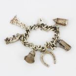 A heavy silver charm bracelet.