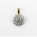 A hallmarked 9ct yellow gold and white gold cluster pendant set with round cut aquamarine, L. 2.