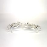 A pair of silver plated crab boxes/ table salts, W. 12cm. H. 3.5cm.