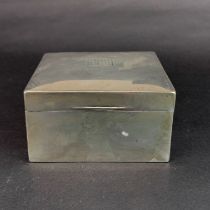 A hallmarked silver covered cigarette box, 9 x 9 x 5cm.