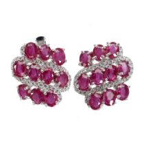A pair of 925 silver earrings set with oval cut rubies and white stones, L. 1.6cm.
