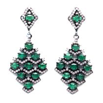 A pair of 925 silver long drop earrings set with emeralds and white stones, L. 4cm.
