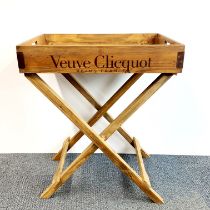 A wooden champagne advertising tray and stand, tray 65 x 45cm. overall H. 79cm.