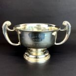 A large hallmarked silver 1930's two handled trophy bowl, W. 25cm. H. 14cm.