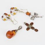 A group of silver and amber jewellery items.