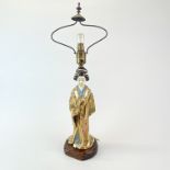 A 1920's Japanese satsuma figure of a Geisha mounted on wooden base as a table lamp, overall H.
