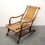 A vintage Chinese red hardwood doctor's chair for patients receiving head treatments or acupuncture,
