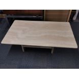 A solid marble coffee table, base and top separate, 120 x 70 x 40cm.