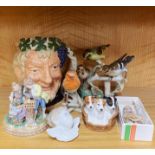 A Royal Doulton character jug together with a Doulton basket of dogs, a Goebel bird figure,