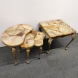 A nest of three stone topped gilt metal mounted kidney tables, largest 59 x 44cm together with a