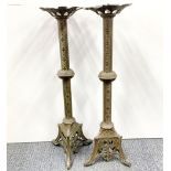 A pair of large 19th century French brass candlesticks mounted at table lamp bases, H. 68cm.