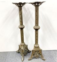 A pair of large 19th century French brass candlesticks mounted at table lamp bases, H. 68cm.