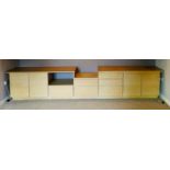 A modern light oak unit comprising of two sideboards and two cabinets.