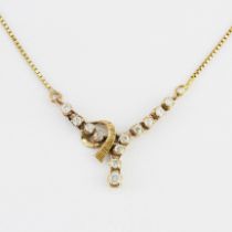 A 12ct yellow gold (marked 12K) diamond set necklace, L. 40cm.