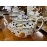 A Royal Crown Derby teapot.