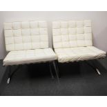 Two white leather and chrome Barcelona chairs by Mies Van De Rohe.