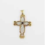 A large hallmarked 9ct yellow and white gold cross pendant set with a garnet and white stones, L.