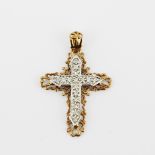 A hallmarked 9ct yellow and white gold cross pendant sent with diamonds, L. 4cm.