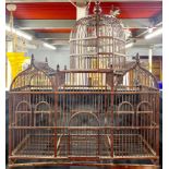 A large bamboo bird cage, 72 x 31 x 89cm, required four replacement pins for dome.