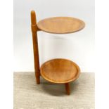 A 1960's oak cake stand, H. 61cm, dia. 32cm.