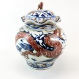 A Chinese hand-painted porcelain jar and cover with underglaze blue and iron red decoration, H.