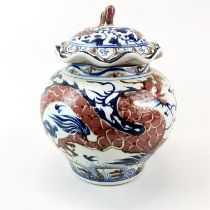 A Chinese hand-painted porcelain jar and cover with underglaze blue and iron red decoration, H.