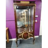 A early 20th century French ormolu mounted mahogany veneered display cabinet with glass shelves, 184