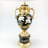 A large 19th century hand painted and gilt soft paste porcelain urn and cover, H. 68cm.