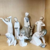 A group of seven Lladro porcelain figures, tallest 24cm.