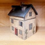A wooden house shaped box, H. 21 x 16 x 14cm.